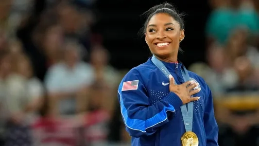 Olympian Simone Biles with her medal