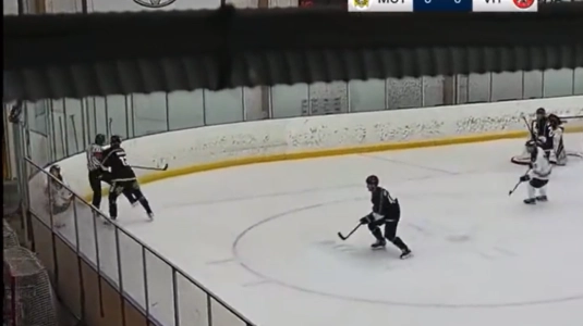 Casper Gillberg drives a referee into the boards with a hit