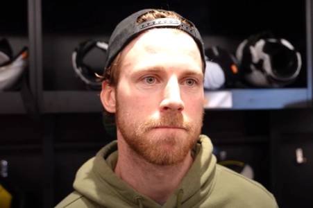 Boston Bruins center Elias Lindholm speaking to the media after a game