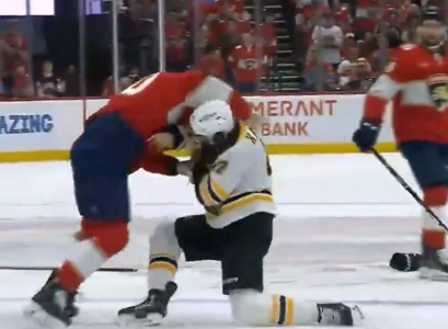 Boston Bruins Mark Kastelic fights AJ Greer of the Florida Panthers