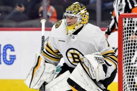 Boston Bruins goaltender Jeremy Swayman playing in an away game in the NHL during the 2023-24 season.
