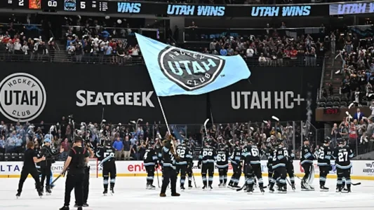 The Utah Hockey Club celebrate their first NHL victory.