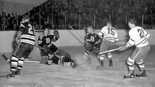 John Henderson seen making a save while a goaltender for the Boston Bruins