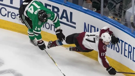 Tyson Jost of the Colorado Avalanche goes down on the ice against the Dallas Stars