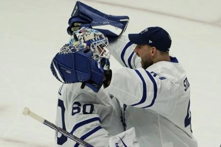Feb 23, 2025; Chicago, Illinois, USA; Toronto Maple Leafs goaltender Joseph Woll (60) and goaltender Anthony Stolarz (41) celebrate their win against the Chicago Blackhawks at United Center. Mandatory Credit: David Banks-Imagn Images