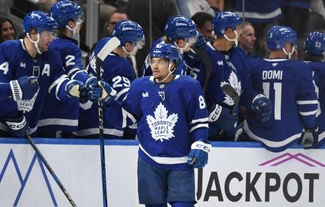 Sep 26, 2024; Toronto, Ontario, CAN; Toronto Maple Leafs forward Nick Robertson (89) celebrates with team mates at the bench after scoring a goal against the Montreal Canadiens in the second period at Scotiabank Arena. Mandatory Credit: Dan Hamilton-Imagn Images