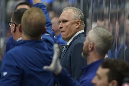 Mar 19, 2025; Toronto, Ontario, CAN; Toronto Maple Leafs head coach Craig Berube (center) watches the action from the bench during the second period against the Colorado Avalanche at Scotiabank Arena. Mandatory Credit: John E. Sokolowski-Imagn Images