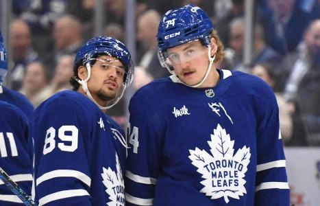 Oct 31, 2024; Toronto, Ontario, CAN; Toronto Maple Leafs forwards Nick Robertson (89) and Bobby McMann (74) converse during a time out against the Seattle Kraken in the first period at Scotiabank Arena. Mandatory Credit: Dan Hamilton-Imagn Images