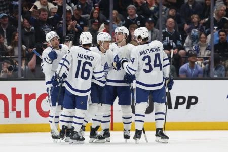 Mar 10, 2025; Salt Lake City, Utah, USA; Toronto Maple Leafs right wing William Nylander (middle) celebrates a goal on a power play against the Utah Hockey Club during the first period at Delta Center. Mandatory Credit: Rob Gray-Imagn Images