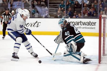 Mar 27, 2025; San Jose, California, USA; San Jose Sharks goaltender Alexandar Georgiev (40) blocks a shot by Toronto Maple Leafs right winger Mitch Marner (16) during a shootout at SAP Center at San Jose. The Sharks won 6-5. Mandatory Credit: D. Ross Cameron-Imagn Images