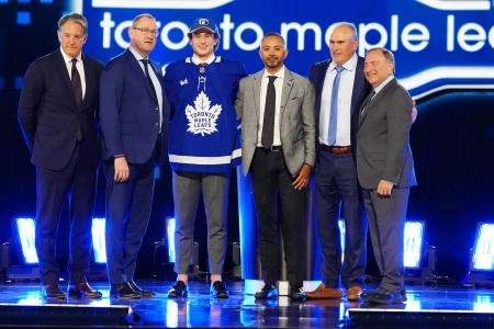 Jun 28, 2024; Las Vegas, Nevada, USA; Ben Danford is selected by the Toronto Maple Leafs with the 31st overall pick in the first round of the 2024 NHL Draft at The Sphere. Mandatory Credit: Stephen R. Sylvanie-Imagn Images