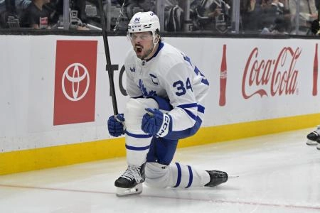 Mar 29, 2025; Los Angeles, California, USA; Toronto Maple Leafs center Auston Matthews (34) celebrates after scoring the go-ahead goal in the third period against the Los Angeles Kings at Crypto.com Arena. Mandatory Credit: Jayne Kamin-Oncea-Imagn Images