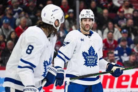 Jan 18, 2025; Montreal, Quebec, CAN; Toronto Maple Leafs left wing Max Pacioretty (67) has a discussion with defenseman Christopher Tanev (8) against the Montreal Canadiens during the second period at Bell Centre. Mandatory Credit: David Kirouac-Imagn Images