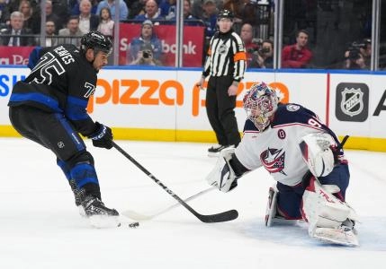 Jan 22, 2025; Toronto, Ontario, CAN; Toronto Maple Leafs right wing Ryan Reaves (75) attempts a shot on Columbus Blue Jackets goaltender Elvis Merzlikins (90) during the first period at Scotiabank Arena. Mandatory Credit: Nick Turchiaro-Imagn Images