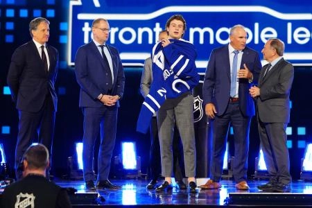 Jun 28, 2024; Las Vegas, Nevada, USA; Ben Danford is selected by the Toronto Maple Leafs with the 31st overall pick in the first round of the 2024 NHL Draft at The Sphere. Mandatory Credit: Stephen R. Sylvanie-Imagn Images