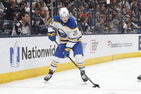 Apr 10, 2025; Columbus, Ohio, USA; Buffalo Sabres center Jiri Kulich (20) picks up a loose puck against the Columbus Blue Jackets during the first period at Nationwide Arena. Mandatory Credit: Russell LaBounty-Imagn Images