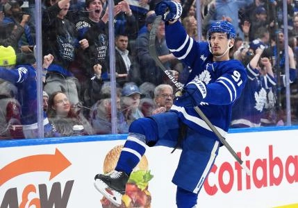 Apr 17, 2025; Toronto, Ontario, CAN; Toronto Maple Leafs defenseman Philippe Myers (51) celebrates scoring a goal against the Detroit Red Wings during the third period at Scotiabank Arena. Mandatory Credit: Nick Turchiaro-Imagn Images