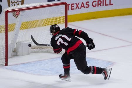 Feb 10, 2024; Ottawa, Ontario, CAN; Ottawa Senators center Ridly Greig (71) scores an empty net goal to seal the win against the Toronto Maple Leafs in the third period at the Canadian Tire Centre.