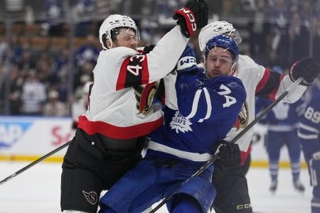 Apr 20, 2025; Toronto, Ontario, CAN; Ottawa Senators defenseman Tyler Kleven (43) hits Toronto Maple Leafs forward Bobby McMann (74) during the third period of game one of the first round of the 2025 Stanley Cup Playoffs at Scotiabank Arena. Mandatory Credit: John E. Sokolowski-Imagn Images