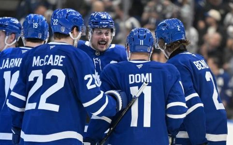 Apr 22, 2025; Toronto, Ontario, CAN; Toronto Maple Leafs forward Auston Matthews (34) greets forward Tie Domi (11) as they celebrate an overtime win over the Ottawa Senators in game two of the first round of the 2025 Stanley Cup Playoffs at Scotiabank Arena. Mandatory Credit: Dan Hamilton-Imagn Images