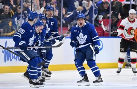 Apr 22, 2025; Toronto, Ontario, CAN; Toronto Maple Leafs forward Max Domi (11) celebrates with team mates after scoring the winning goal in overtime against the Ottawa Senators in game two of the first round of the 2025 Stanley Cup Playoffs at Scotiabank Arena. Mandatory Credit: Dan Hamilton-Imagn Images