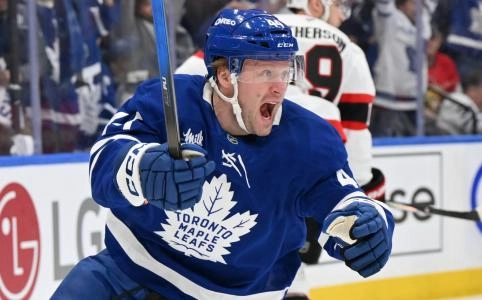 Apr 22, 2025; Toronto, Ontario, CAN; Toronto Maple Leafs defenseman Morgan Rielly (44) celebrates after scoring a goal against the Ottawa Senators in the first period in game two of the first round of the 2025 Stanley Cup Playoffs at Scotiabank Arena. Mandatory Credit: Dan Hamilton-Imagn Images
