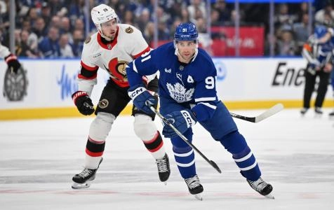 Apr 22, 2025; Toronto, Ontario, CAN; Toronto Maple Leafs forward John Tavares (91) skates ahead of Ottawa Senators forward Drake Batherson (19) in the first period in game two of the first round of the 2025 Stanley Cup Playoffs at Scotiabank Arena. Mandatory Credit: Dan Hamilton-Imagn Images