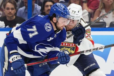 Apr 24, 2025; Tampa, Florida, USA; Florida Panthers defenseman Niko Mikkola (77) blocks Tampa Bay Lightning center Anthony Cirelli (71) during the third period in game two of the first round of the 2025 Stanley Cup Playoffs at Amalie Arena. Mandatory Credit: Nathan Ray Seebeck-Imagn Images