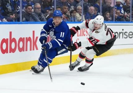 Apr 29, 2025; Toronto, Ontario, CAN; Toronto Maple Leafs center Max Domi (11) battles for the puck with Ottawa Senators defenseman Thomas Chabot (72) in the third period during game five of the first round of the 2025 Stanley Cup Playoffs at Scotiabank Arena. Mandatory Credit: Nick Turchiaro-Imagn Images