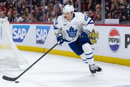 Apr 26, 2025; Ottawa, Ontario, CAN; Toronto Maple Leafs defenseman Jake McCabe (22) skates with the puck in game four of the first round of the 2025 Stanley Cup Playoffs against the Ottawa Senators at the Canadian Tire Centre. Mandatory Credit: Marc DesRosiers-Imagn Images