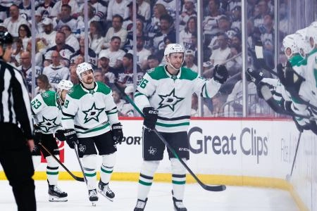 May 7, 2025; Winnipeg, Manitoba, CAN; Dallas Stars forward Mikko Rantanen (96) is congratulated by his team mates against the Winnipeg Jets during the second period in game one of the second round of the 2025 Stanley Cup Playoffs at Canada Life Centre. Mandatory Credit: Terrence Lee-Imagn Images