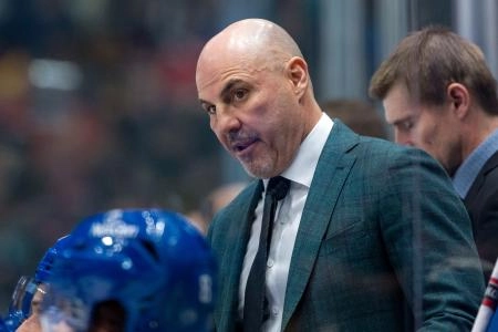 Nov 12, 2024; Vancouver, British Columbia, CAN; Vancouver Canucks head coach Rick Tocchet on the bench against the Calgary Flames during the second period at Rogers Arena. Mandatory Credit: Bob Frid-Imagn Images