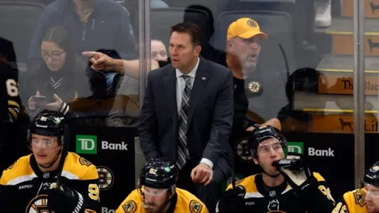 Boston Bruins bench with interim head coach Joe Sacco.
