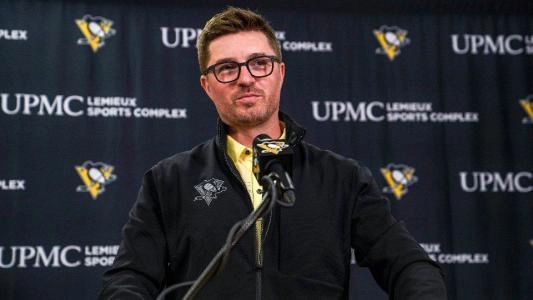 Pittsburgh Penguins GM Kyle Dubas smirks as he speaks to the media