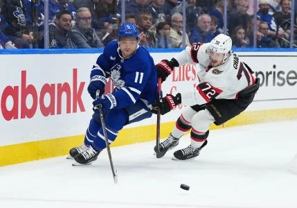 Apr 29, 2025; Toronto, Ontario, CAN; Toronto Maple Leafs center Max Domi (11) battles for the puck with Ottawa Senators defenseman Thomas Chabot (72) in the third period during game five of the first round of the 2025 Stanley Cup Playoffs at Scotiabank Arena. Mandatory Credit: Nick Turchiaro-Imagn Images
