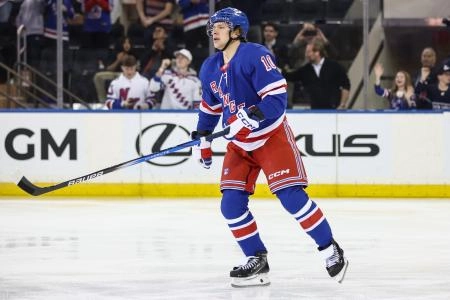 Mar 18, 2025; New York, New York, USA; New York Rangers left wing Artemi Panarin (10) skates back to the bench after scoring a goal in the first period against the Calgary Flames at Madison Square Garden. Mandatory Credit: Wendell Cruz-Imagn Images
