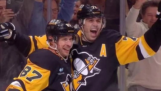 Sidney Crosby and Evgeni Malkin celebrate a goal