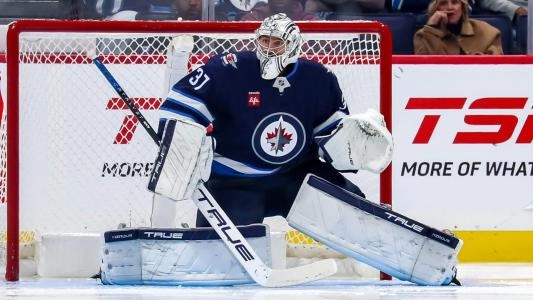 Winnipeg Jets' Connor Hellebuyck makes a save during a hockey game