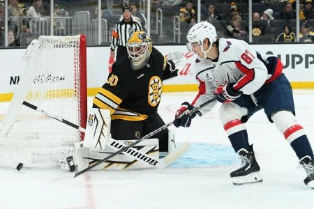 Former Vancouver Canucks goaltender Michael DiPietro making a save during a game with the Boston Bruins.