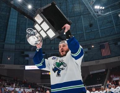 Sammy Blais hoisting the Calder Cup with the Abbotsford Canucks.