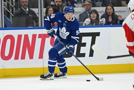 Oct 13, 2025; Toronto, Ontario, CAN; Toronto Maple Leafs right wing Easton Cowan (53) controls the puck in the first period against the Detroit Red Wings at Scotiabank Arena. Mandatory Credit: Gerry Angus-Imagn Images