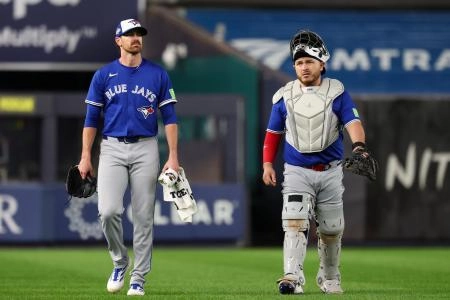 Oct 7, 2025; Bronx, New York, USA; Toronto Blue Jays starting pitcher Shane Bieber (57) and catcher Alejandro Kirk (30) walks to the dugout prior to the game against the New York Yankees during game three of the ALDS round for the 2025 MLB playoffs at Yankee Stadium.