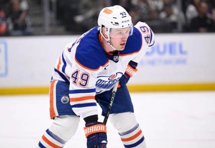 Oilers' defenseman Ty Emberson lines-up for a faceoff