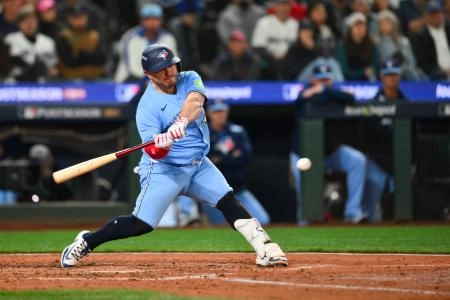 Oct 15, 2025; Seattle, Washington, USA; Toronto Blue Jays catcher Alejandro Kirk (30) hits a three run home run during the sixth inning against the Seattle Mariners during game three of the ALCS round for the 2025 MLB playoffs at T-Mobile Park. Mandatory Credit: Steven Bisig-Imagn Images