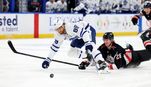 Oct 24, 2025; Buffalo, New York, USA; Toronto Maple Leafs right wing William Nylander (88) skates with the puck as Buffalo Sabres defenseman Rasmus Dahlin (26) gets called for a tripping penalty during the first period at KeyBank Center. Mandatory Credit: Timothy T. Ludwig-Imagn Images