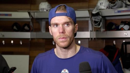 Edmonton Oilers' Connor McDavid listens to a question