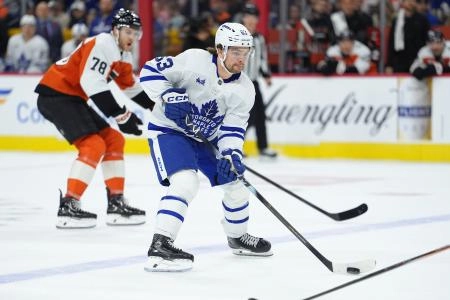 Nov 1, 2025; Philadelphia, Pennsylvania, USA; Toronto Maple Leafs left wing Matias Maccelli (63) controls the puck against the Philadelphia Flyers in the first period at Xfinity Mobile Arena. Mandatory Credit: Kyle Ross-Imagn Images