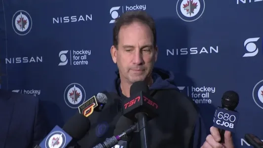 Winnipeg Jets coach Scott Arniel speaks to reporters