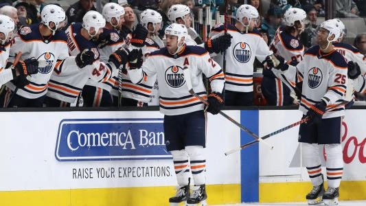 Edmonton Oilers' Milan Lucic celebrates a goal with his teammates on the bench