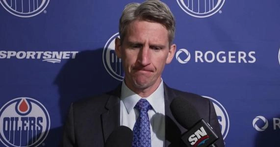 Edmonton Oilers head coach Kris Knoblauch with a serious face answering questions